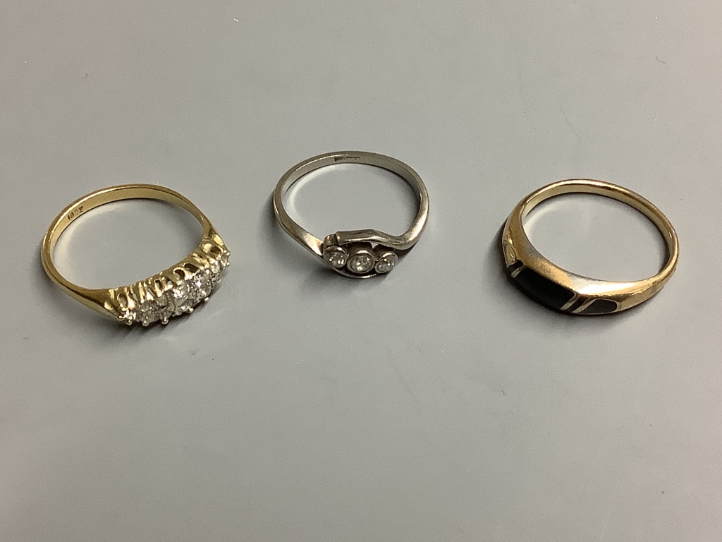 Two 18ct and diamond set rings, gross 5.7 grams and an enamelled ring (a.f.).